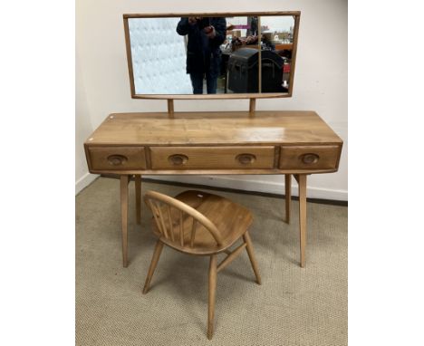 A 1960s Ercol elm and beech dressing table, with raised mirror over three frieze drawers on splayed beech supports, 114 cm wi