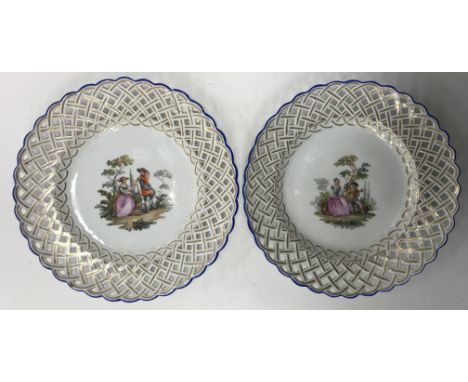 A 19th Century Meissen cabinet plate with basket work rim enclosing a centre field decorated with a figure serenading a lady 