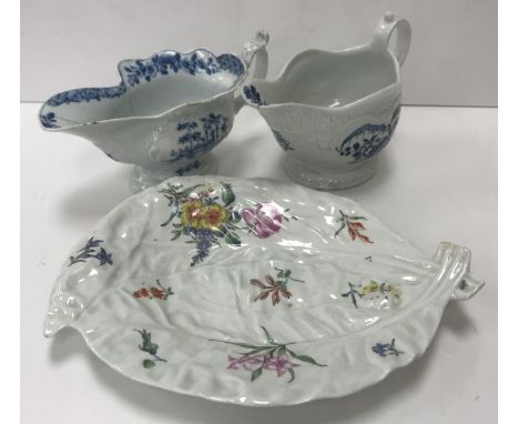 An 18th Century Philip Christian Liverpool sauce boat with impressed pattern decoration and blue and white Chinese rock and w