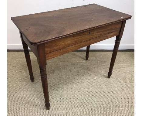 A late 19th Century mahogany dressing table, the plain top with moulded edge opening to reveal a fabric-lined interior with m