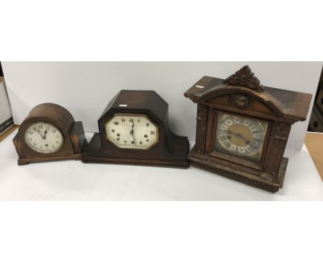 A 19th Century German walnut cased mantel clock with eight day movement and Roman numerals to the chapter ring, 32 cm wide x 