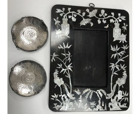 A Chinese mother of pearl inlaid lacquered photograph or picture frame with decoration of exotic birds amongst bamboo and fol