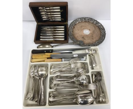 A box of various plated wares to include plated on copper salver with engraved decoration, large fiddle pattern serving spoon