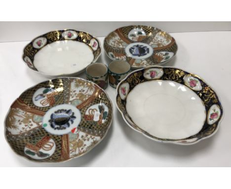 A pair of Chinese Imari palette decorated plates with panelled and fruit decoration each bearing character marks to base 22 c