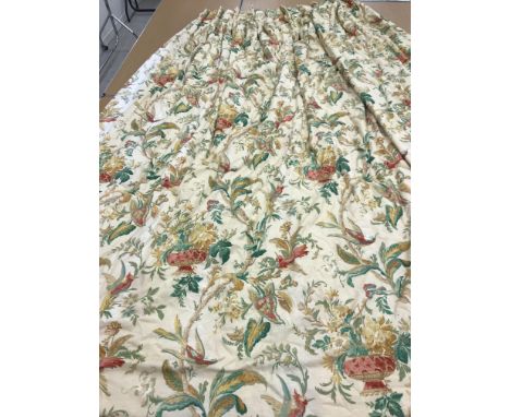 A pair of linen type interlined curtains with fixed triple pencil pleat headings, the cream ground with yellow, green and red