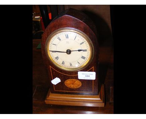 A 23cm high Edwardian lancet shaped mantel clock 