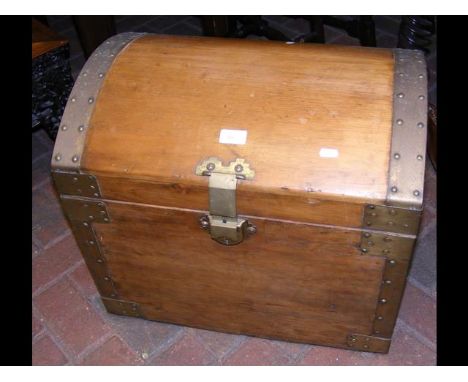 A metal bound dome top trunk 