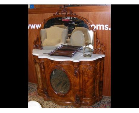 An interesting Victorian walnut and marble top and mirrored back credenza, having mirrored door - the owner believes that thi