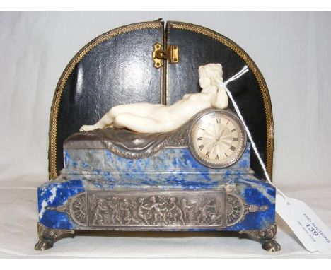 A fine quality early 20th century clock with lapis lazuli and silver mounts in the form of a couch, with ivory reclining nude