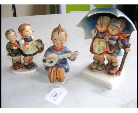 A large Hummel figure, together with two others 