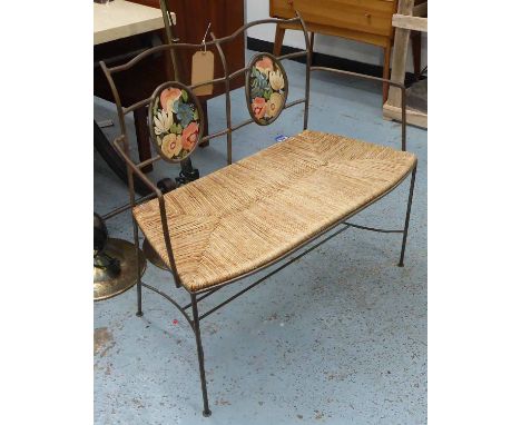 BENCH, Arts and Crafts style, wrought iron with a rush seat and floral painted back panels, 95cm x 87cm H.