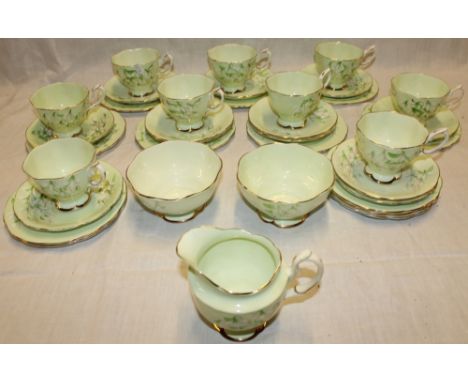 A Royal Albert "Laurentian Snowdrop" pattern part tea set comprising 9 tea cups, 12 saucers, 12 tea plates, milk jug and two 
