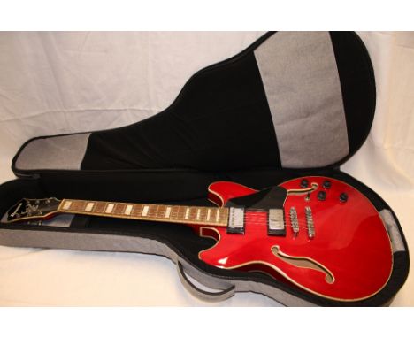 An Ibanez electric semi-acoustic guitar model number AS73-TCD 59-05, serial number PW21110765 in fitted transit case 