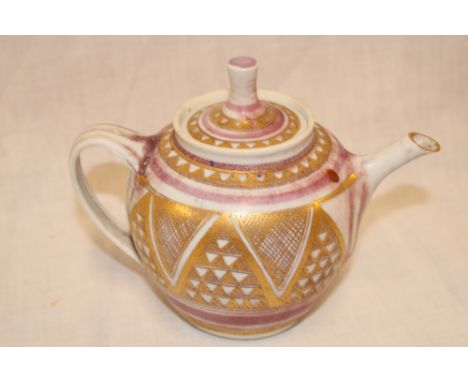 A Cornish studio pottery teapot by Mary Rich with pink and gilt decoration, 5" high 