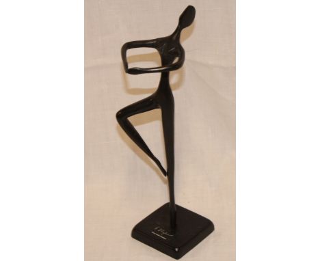 A modern bronze abstract figure of a dancing form marked "Bodrul Khalique", 11" high 
