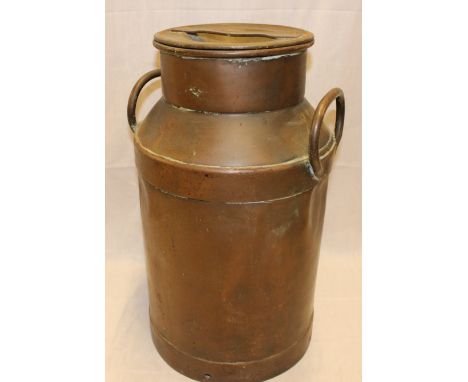 An old copper cylindrical milk churn and cover, 21" high 