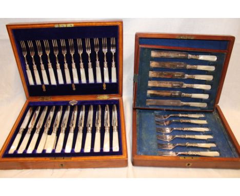 A set of six electro-plated tea knives and forks with mother of pearl handles in lined mahogany case and one other set of twe