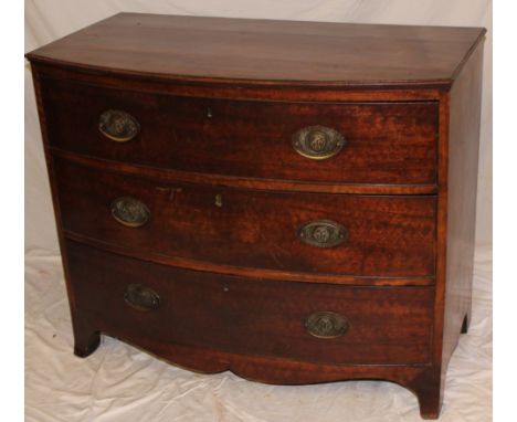 A 19th Century mahogany bow-front chest of three long drawers with brass ring handles on bracket feet, 32" high x 38½" wide