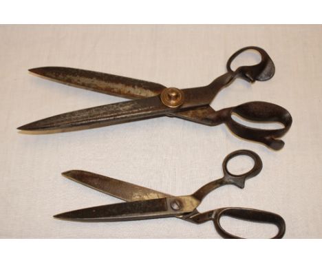 A large pair of brass mounted steel tailor's shears/scissors by Wilkinson  & Son of Sheffield, 16½" long and one other large 