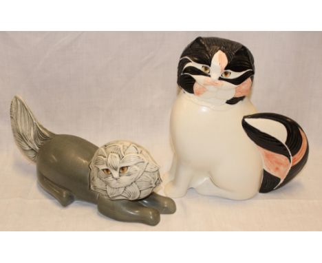 A Goebel china figure of a seated cat dated 1984, 10" high and one other Goebel china figure of a recumbent cat (2)