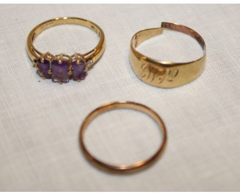 A 9ct gold wedding band, 9ct gold dress ring set amethyst and one other (3) (5.7g)
