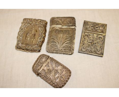 A Continental sterling silver rectangular visiting card case decorated in relief with a cathedral emblem and three various fi