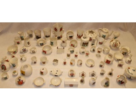 A collection of over 70 various Goss souvenir crested china including teapots, vases, jugs, bowls and related items 