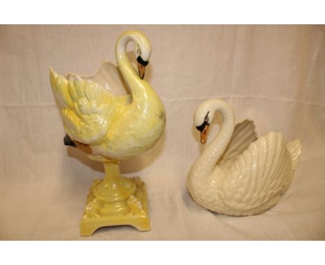 A Dartmouth pottery yellow glazed swan jardiniere on square-shaped base, 17½" high and one other Dartmouth pottery swan plant