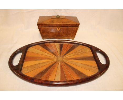 An unusual mahogany framed oval two handled tea tray, the centre with a display of radiating wood samples, 22" long and a 19t