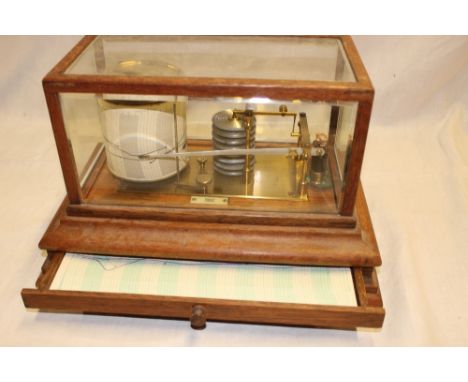 A good quality brass barograph by Ross Ltd London in oak glazed rectangular case with base drawer 
