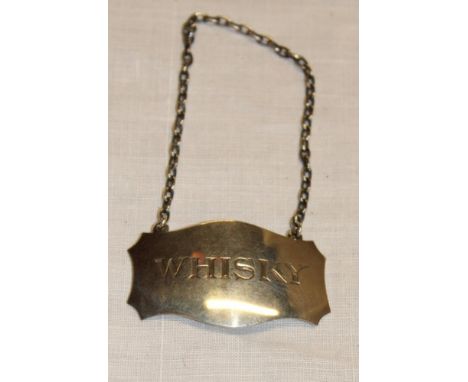 A George V silver decanter label "Whisky", Edinburgh marks 1930