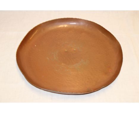 A Newlyn copper circular tray with incised galleon ship decoration, 13½" diameter