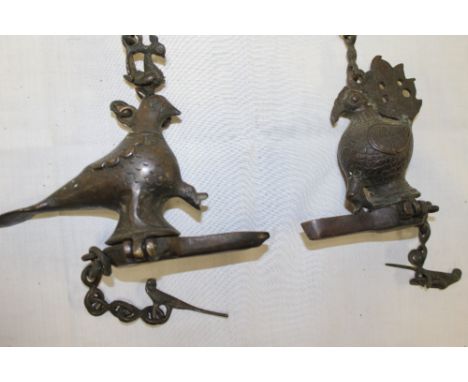 Two Eastern bronze incense burners in the form of birds with hinged bases and matching bronze chains 