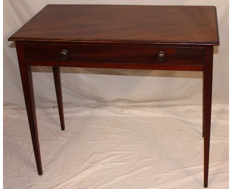 A 19th Century mahogany rectangular side table with a single drawer in the frieze on square tapered legs, 33" long