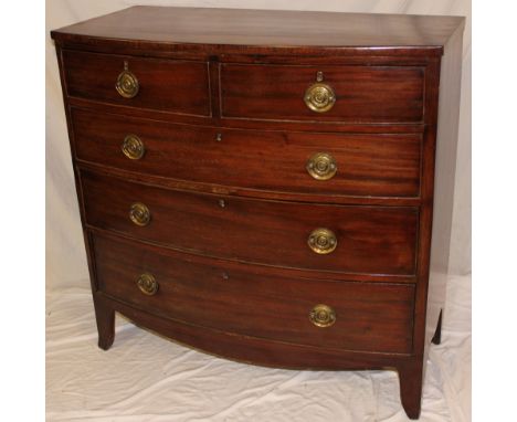 A 19th century mahogany bow-front chest of two short and three long drawers with brass ring handles on bracket feet, 40½" hig