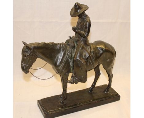 A good quality bronze figure of a cowboy on a horse signed A R White on rectangular base, 12½" high 