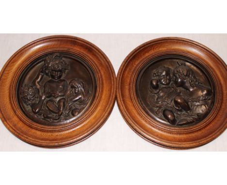 A pair of 19th Century bronze relief decorated circular plaques by E. W. Wyon 1848 depicting and female and children, 7" diam