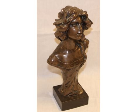 A 20th Century bronze Art Nouveau-style bust of a female on black marble base, 13½" high overall 