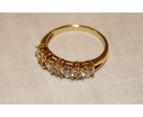 An 18ct gold engagement ring set 10 diamond-style stones (3.3g)