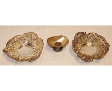 A pair of late Victorian silver sweetmeat dishes with raised floral and pierced decoration, Birmingham marks 1897 and a small