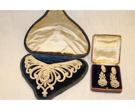 A good quality Victorian mother of pearl and pearl mounted collarette/tiara with raised and pierced decoration by F. L. Hausb