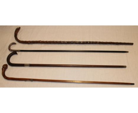 Four various walking sticks including a gentlemans ebonised walking cane with silvered curved top, natural walking stick with