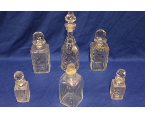 A good quality cut-glass tapered decanter and stopper, pair of cut-glass square decanters and stoppers, one with a silver-pla