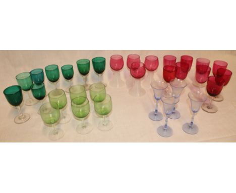 A selection of cranberry tinted wine glasses, green tinted wine glasses, cranberry tinted hock glasses and others etc 