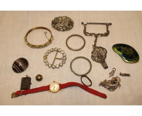 A jewellery box containing a selection of various silver mounted and other jewellery including brooches, pearl decorated bang