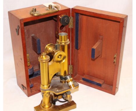 A brass monocular microscope by R & J Beck Ltd of London in fitted mahogany case with presentation plaque "Frederick Percival