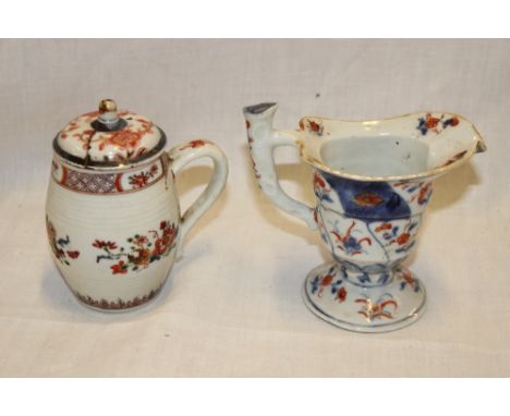 A late 18th, early 19th Century pedestal jug with blue and red floral decoration, 5" high and one other early Eastern china b