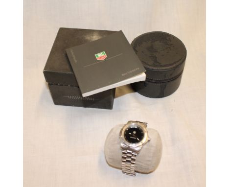 A gentlemans wristwatch by Tag Heuer with black circular dial in stainless steel mounts No. WK111A-0 TW1855 in original box w