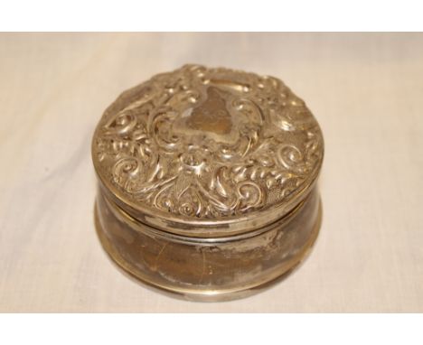A small silver circular trinket box with scroll decorated hinged lid, Birmingham marks