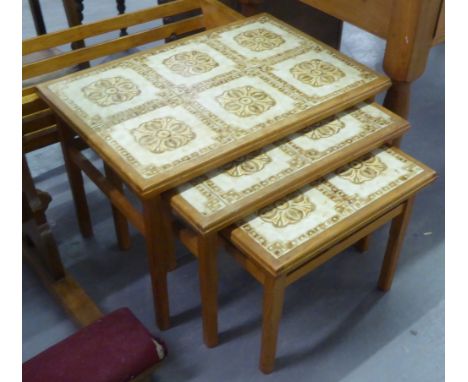 A NEST OF THREE TABLES WITH INSET TILE TOPS AND A WOODEN FRAMED PLANT TROUGH